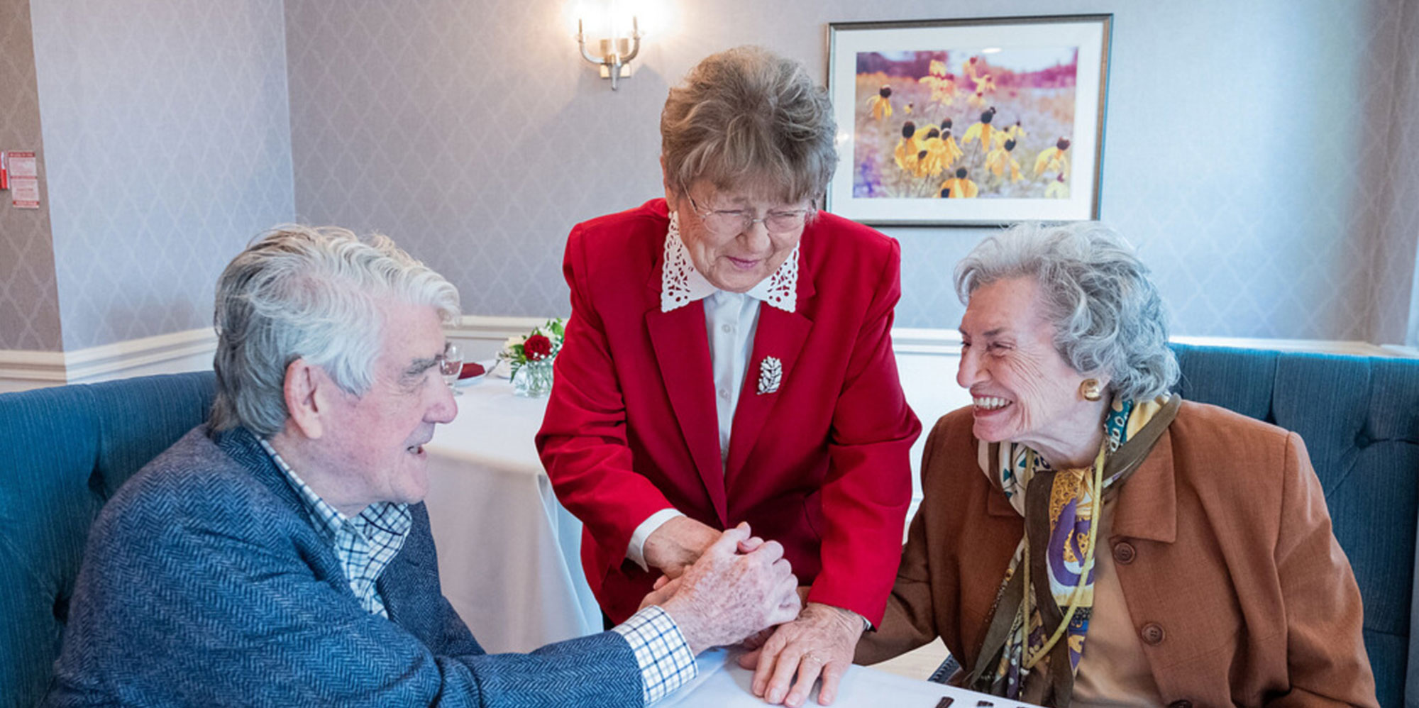 Three Atrium Retirement residents smiling